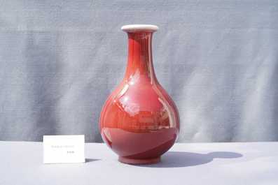 A Chinese monochrome langyao-glazed bottle vase, marked 'Made in Jingdezhen in 1955'
