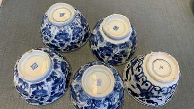 A collection of Chinese and Japanese blue and white cups and saucers and two ewers, Wanli and later