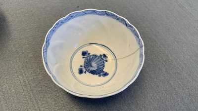 A collection of Chinese and Japanese blue and white cups and saucers and two ewers, Wanli and later