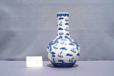 A Chinese blue and white 'dragons' bottle vase, Yongzheng mark, 19th C.