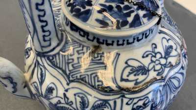 A collection of Chinese and Japanese blue and white cups and saucers and two ewers, Wanli and later