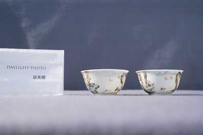 A fine Chinese 'landscape' teapot and a pair of cups and saucers, Yongzheng