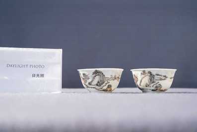 A fine Chinese 'landscape' teapot and a pair of cups and saucers, Yongzheng