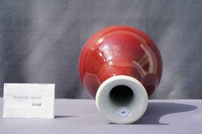 A Chinese monochrome langyao-glazed bottle vase, marked 'Made in Jingdezhen in 1955'