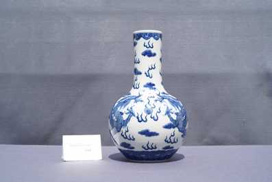 A Chinese blue and white 'dragons' bottle vase, Yongzheng mark, 19th C.