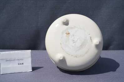 A Chinese Dehua blanc de Chine tripod censer with an incised design, Kangxi