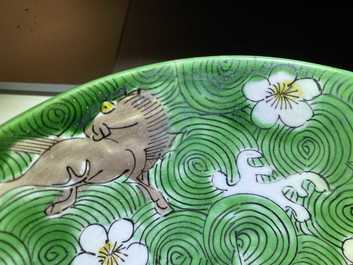 A shallow Chinese verte biscuit 'mythical beast' bowl, Jiajing mark, Kangxi