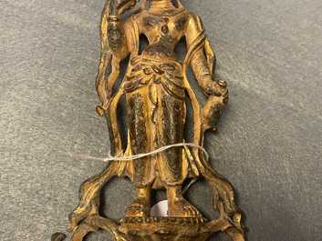 A Chinese gilt bronze figure of Buddha standing, probably Northern Wei dynasty