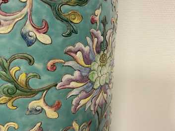 A large Chinese famille rose cylindrical vase with molded lotus scrolls, Jiaqing/Daoguang