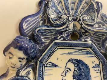A pair of Dutch Delft blue and white appliques with royalist portraits of prince William IV and princess Anne, 18th C.