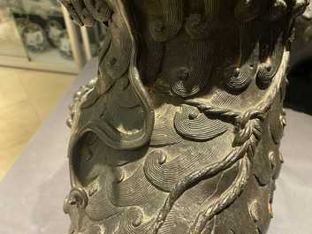 A pair of large Chinese bronze models of Buddhist lions, Ming