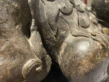 A pair of large Chinese bronze models of Buddhist lions, Ming