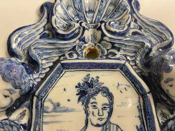 A pair of Dutch Delft blue and white appliques with royalist portraits of prince William IV and princess Anne, 18th C.