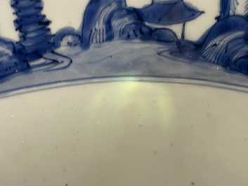 A large Chinese blue and white 'river landscape' bowl, Ming