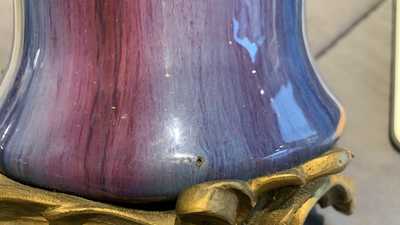 Un vase en porcelaine de Chine &agrave; &eacute;mail flamb&eacute; &agrave; monture en bronze dor&eacute;, 19&egrave;me