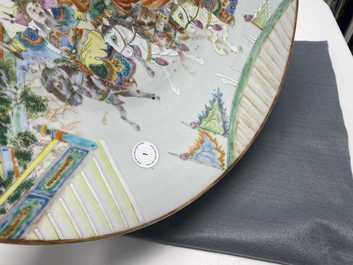 A large Chinese Canton famille rose 'horseriders' dish, 19th C.
