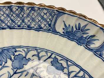 A ribbed Dutch Delft blue and white chinoiserie 'dragon' dish, 18th C.