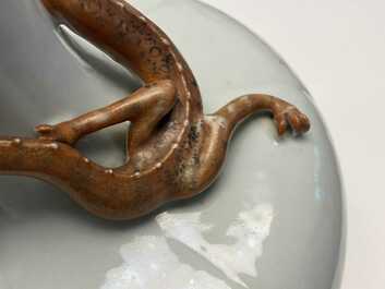 A Chinese white-glazed garlic head vase with an applied dragon, 19th C.