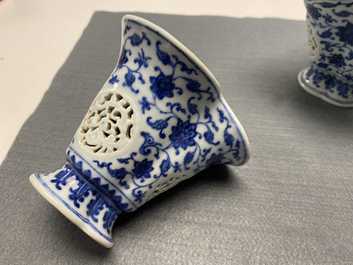 A pair of rare Chinese blue and white double-walled reticulated trilobed libation cups, Qianlong