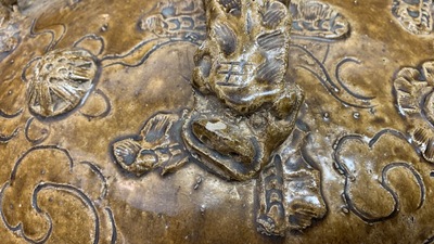 A large Chinese brown-glazed relief-molded martaban jar with Buddhist lions, Ming