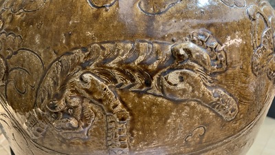 A large Chinese brown-glazed relief-molded martaban jar with Buddhist lions, Ming