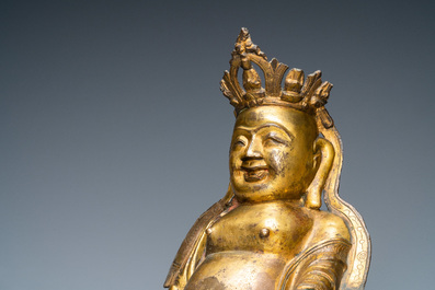 A Chinese gilt bronze figure of the seated Buddha, Ming