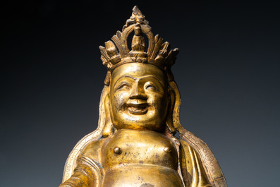 A Chinese gilt bronze figure of the seated Buddha, Ming