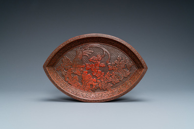 A Chinese pointed oval red cinnabar lacquer 'peacock' tray, three-character mark, Qianlong