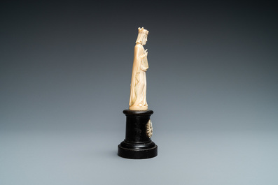 An ivory figure of a female saint holding a book, 19th C.