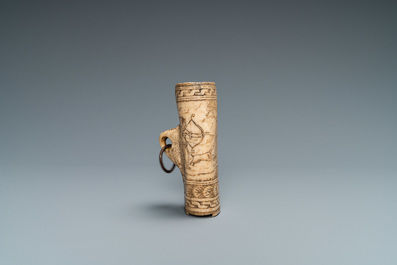 The central part of a stag horn powder flask with engraved design of 'Diana hunting deer', 17th C.