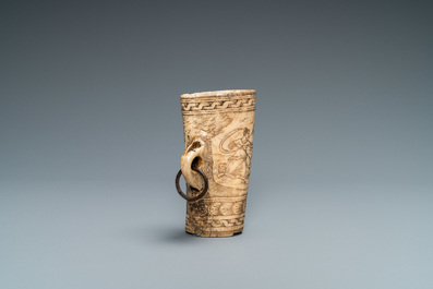 The central part of a stag horn powder flask with engraved design of 'Diana hunting deer', 17th C.