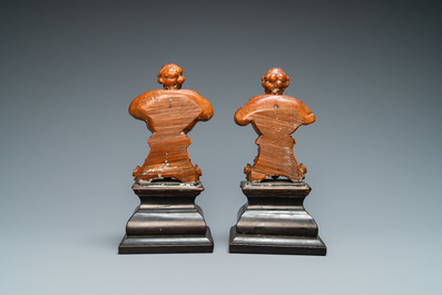 A pair of boxwood busts of a saint on an ebony veneer base, 17th C.