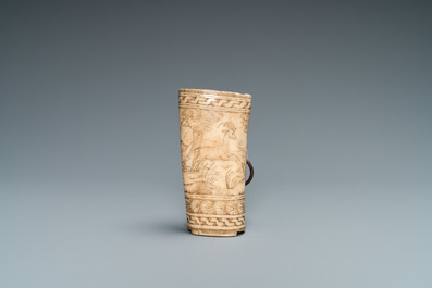 The central part of a stag horn powder flask with engraved design of 'Diana hunting deer', 17th C.