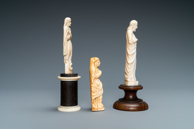 Two figures of Madonna and one of Christ in ivory and bone, 19th C.