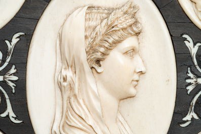 Five ivory portrait medallions set in a pewter-mounted ebony frame, France and/or Italy, 19th C.