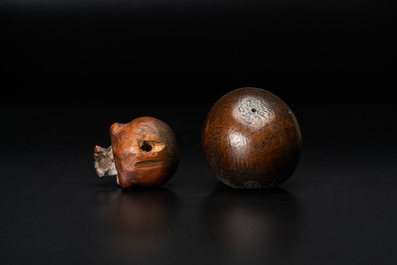 Two wooden memento mori skulls, 17/18th C.