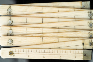 An ivory-handled knife depicting the theological virtue of faith and an ivory folding tailor's ruler, 17/18th and 19th C.