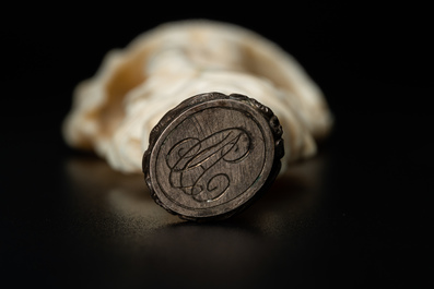 An ivory and silver seal stamp with a hussar handle, 19th C.