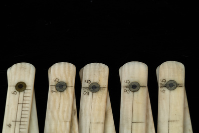 An ivory-handled knife depicting the theological virtue of faith and an ivory folding tailor's ruler, 17/18th and 19th C.