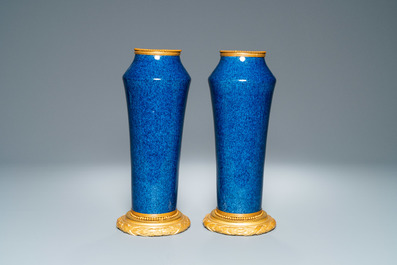 A pair of monochome powder blue S&egrave;vres vases with gilded bronze mounts, 19th C.