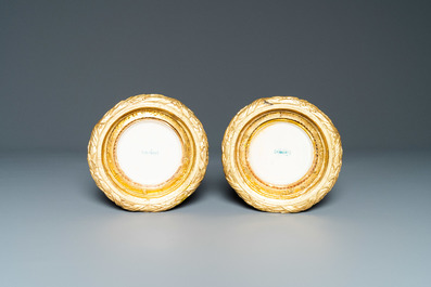 A pair of monochome powder blue S&egrave;vres vases with gilded bronze mounts, 19th C.