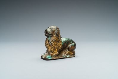 A gilt-bronze model of a recumbent lion, France, 14th C.