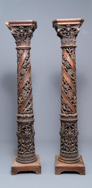 A pair of reticulated carved oak Corinthian columns with cherub heads and vines, 17th C.