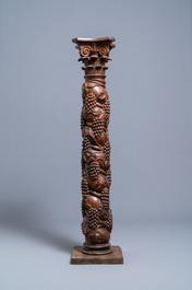 A carved walnut Ionic column with grapevines, 17th C.