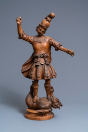 An oak figure of the archangel Michael defeating the devil, 17th C.