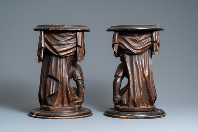 A pair of patinated coniferous wood candle supports in the shape of kneeling Moors, Venice, Italy, 17/18th C.