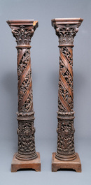 A pair of reticulated carved oak Corinthian columns with cherub heads and vines, 17th C.