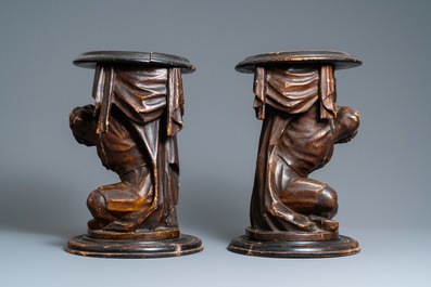 A pair of patinated coniferous wood candle supports in the shape of kneeling Moors, Venice, Italy, 17/18th C.