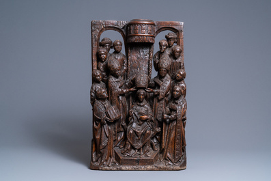 A fine oak group depicting the coronation of a bishop, North of France, ca. 1500