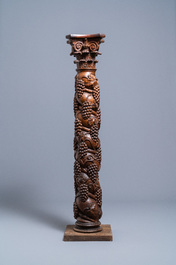 A carved walnut Ionic column with grapevines, 17th C.